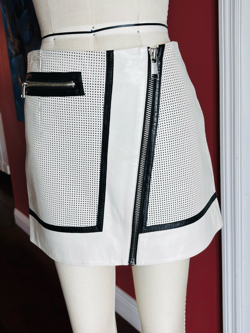 NWOT - Andrew Marc White Leather Perforated Mini Skirt with Black Trim and Zip